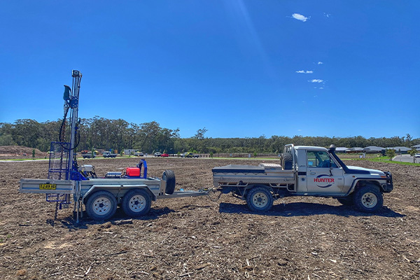Trailer-mounted geotechnical drilling rig
